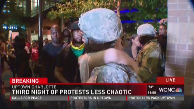 Protesters, members of National Guard share hugs during protests | wcnc.com